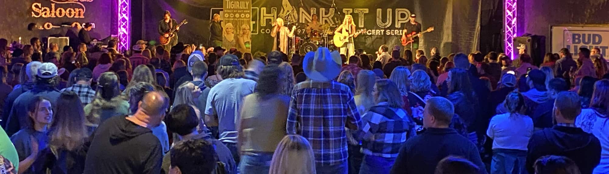 country concert with fans wearing cowboy hats Oklahoma City