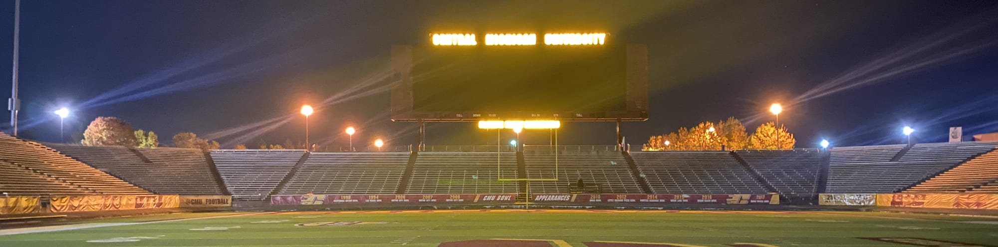 empty football stadium at night under the lights Oklahoma City